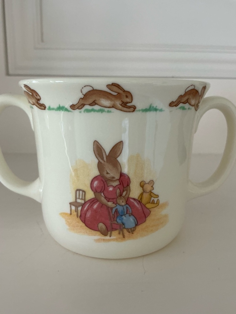 BUNNYKINS Children Bunny Double-Handled Mug in Cream with Pink & Blue Motif